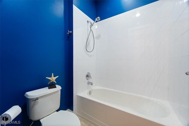 bathroom with tub / shower combination and toilet