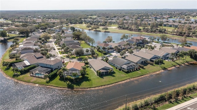 drone / aerial view featuring a water view and a residential view