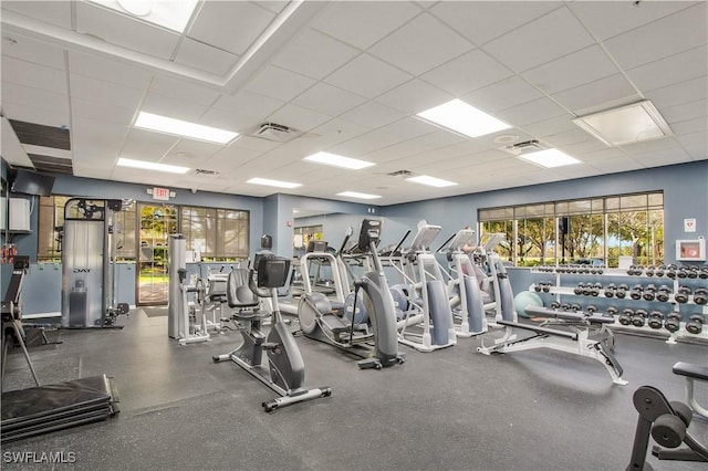 workout area with a paneled ceiling and visible vents