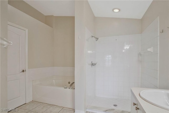 full bath featuring tile patterned flooring, tiled shower, vanity, and a bath