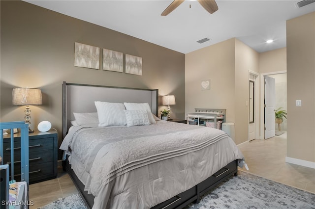 bedroom with baseboards, visible vents, and a ceiling fan