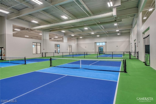 view of tennis court featuring fence