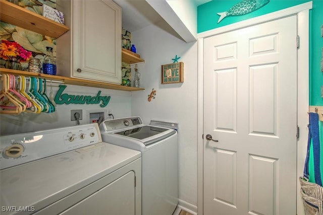 laundry area with cabinet space and washer and dryer