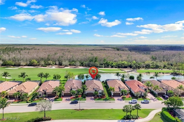 aerial view with view of golf course, a water view, and a residential view