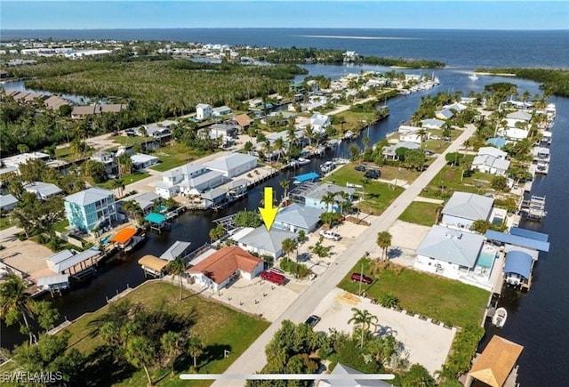 birds eye view of property featuring a residential view and a water view