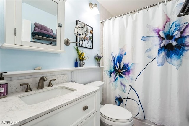 16221 Buccaneer St, Bokeelia, FL 33922 - bathroom with a shower with shower curtain, toilet, and vanity