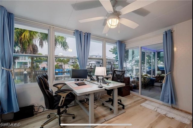 16221 Buccaneer St, Bokeelia, FL 33922 - office with light wood-style flooring and ceiling fan