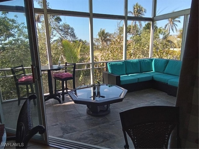 sunroom / solarium featuring plenty of natural light