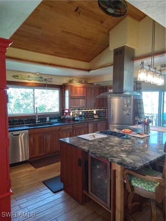 kitchen featuring light wood finished floors, appliances with stainless steel finishes, brown cabinetry, wood ceiling, and island range hood