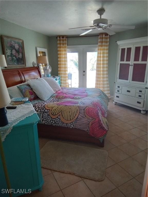 bedroom with light tile patterned floors, access to outside, french doors, and a ceiling fan