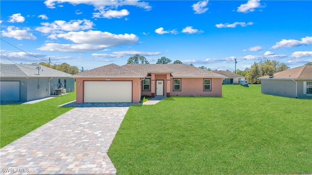 ranch-style home featuring a garage, decorative driveway, a front yard, and stucco siding