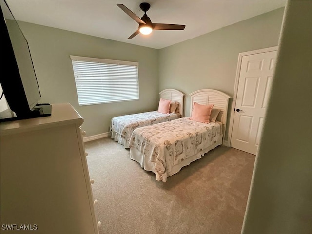 bedroom with carpet flooring, ceiling fan, and baseboards