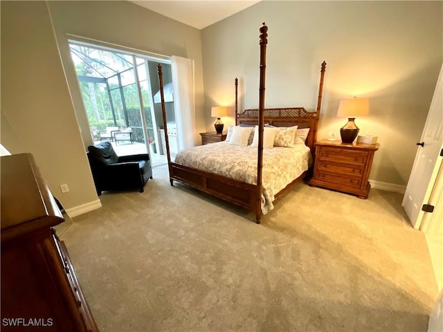 bedroom featuring access to exterior, light carpet, and baseboards