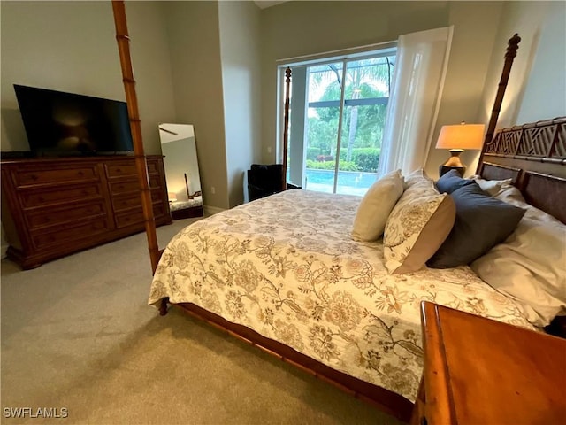 carpeted bedroom with access to outside