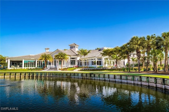 rear view of house with a water view