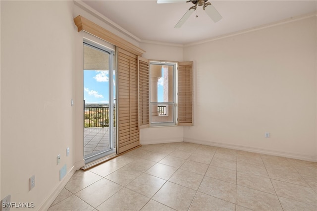 empty room with crown molding, light tile patterned floors, a ceiling fan, and baseboards