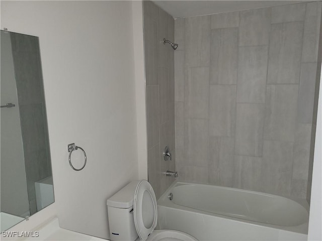 full bath with washtub / shower combination and toilet