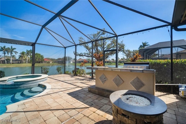 view of patio / terrace featuring a water view, a pool with connected hot tub, a lanai, and a bar