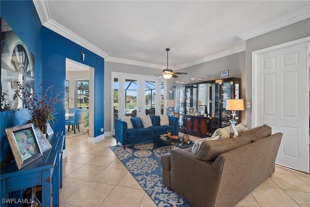 living room featuring baseboards, a ceiling fan, ornamental molding, french doors, and light tile patterned flooring