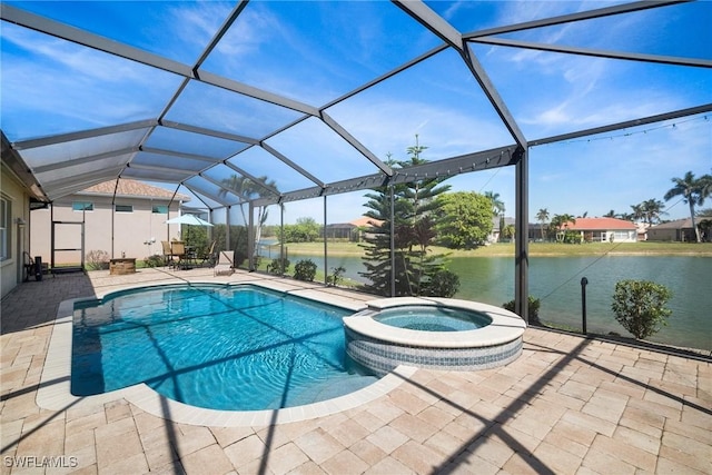 view of pool with a patio, a water view, a lanai, and a pool with connected hot tub