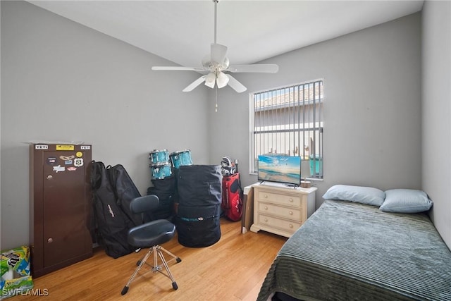 bedroom with a ceiling fan and light wood finished floors