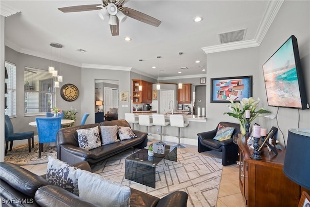 living room featuring crown molding, light tile patterned floors, recessed lighting, visible vents, and ceiling fan with notable chandelier