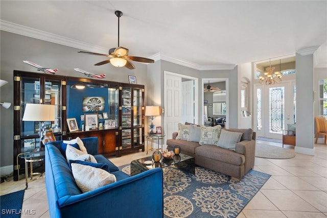 living room featuring light tile patterned floors, baseboards, and crown molding