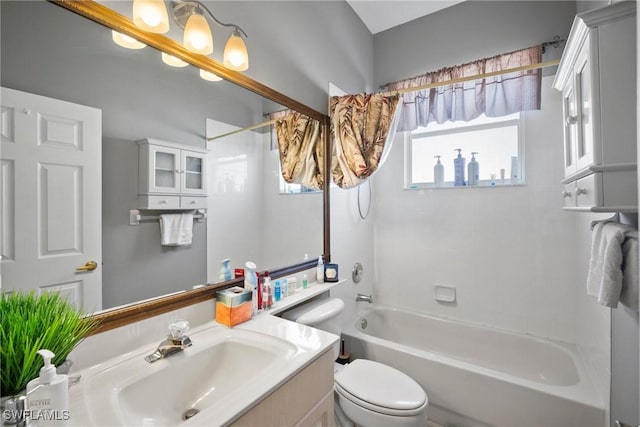 bathroom with shower / bathing tub combination, vanity, and toilet