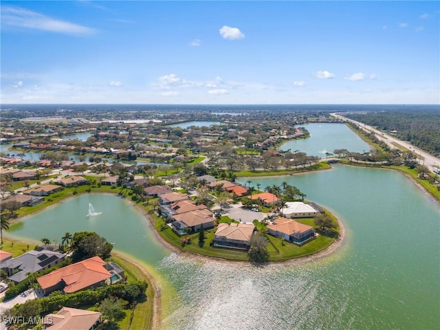 bird's eye view with a water view and a residential view