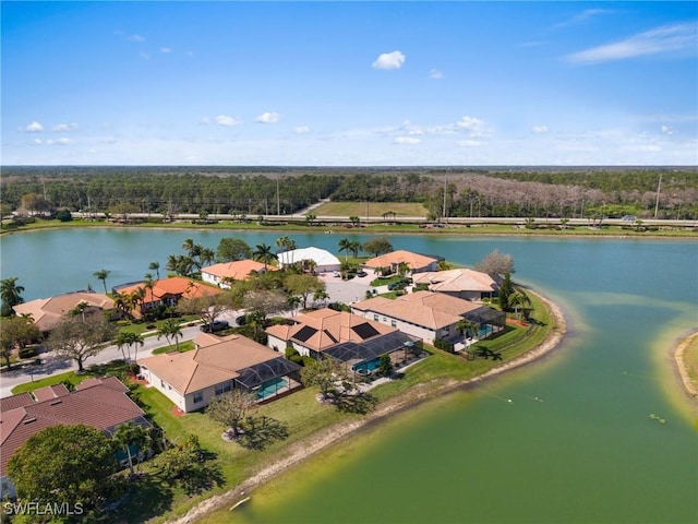 birds eye view of property with a water view and a residential view