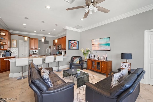 living room with light tile patterned floors, baseboards, crown molding, and recessed lighting