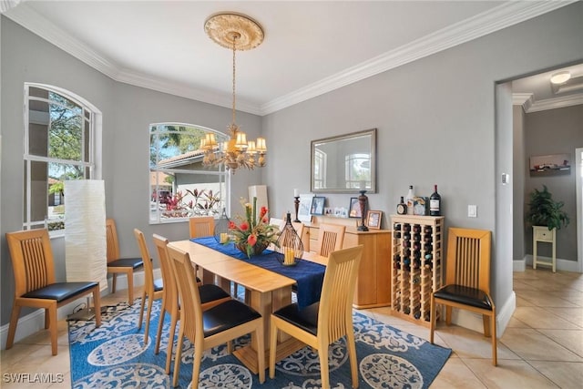 dining area featuring light tile patterned floors, ornamental molding, baseboards, and an inviting chandelier