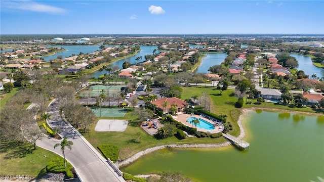 birds eye view of property with a water view and a residential view