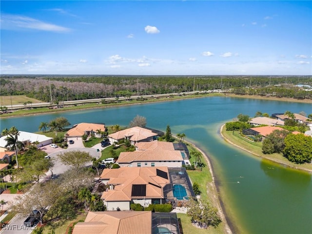 drone / aerial view with a water view and a residential view