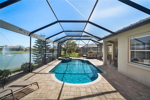 view of swimming pool with a patio, a water view, a lanai, and a pool with connected hot tub