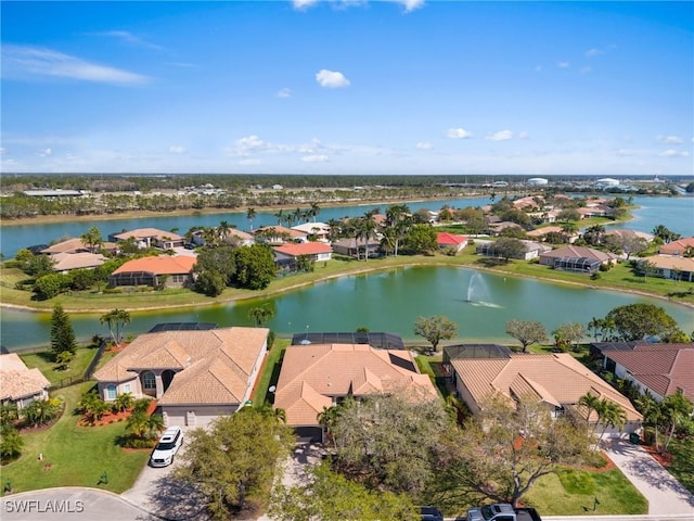 birds eye view of property featuring a residential view and a water view