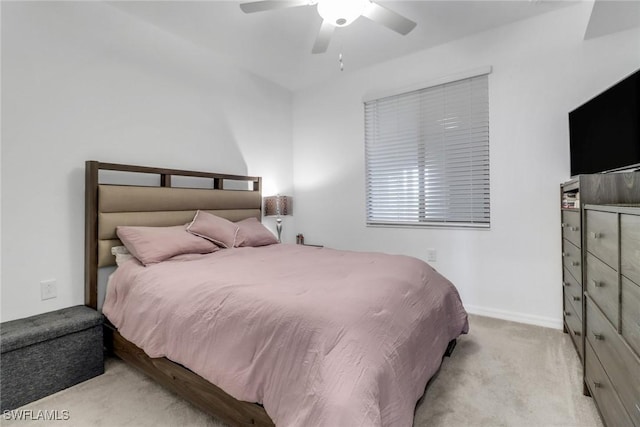 carpeted bedroom featuring ceiling fan and baseboards