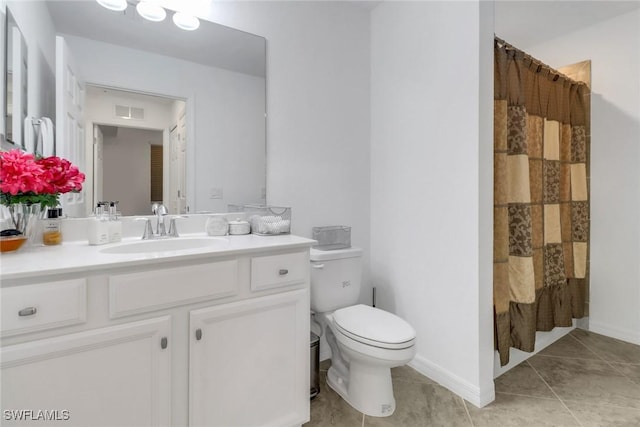 bathroom featuring visible vents, toilet, vanity, a shower with curtain, and tile patterned floors