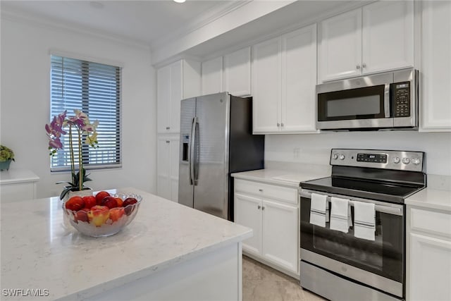 kitchen featuring stainless steel appliances, white cabinetry, crown molding, and light stone countertops