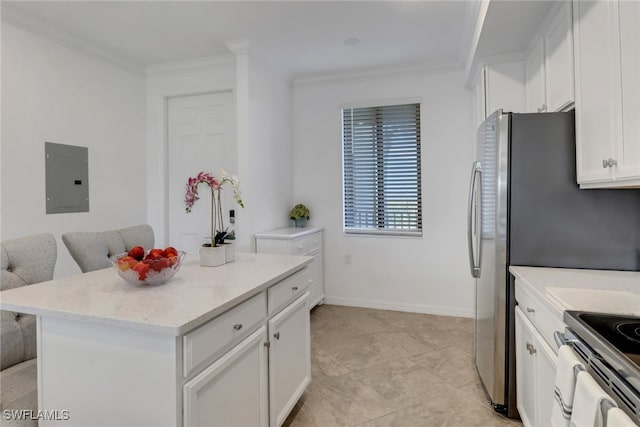 kitchen featuring electric panel, a kitchen island, white cabinets, and crown molding