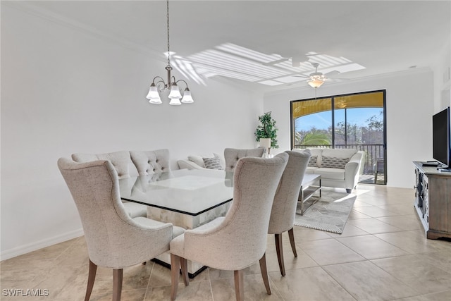 dining room with light tile patterned floors, ornamental molding, ceiling fan with notable chandelier, and baseboards