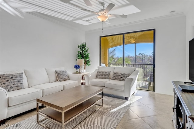 living area featuring light tile patterned floors, a ceiling fan, and crown molding