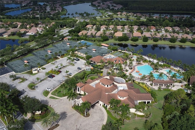 drone / aerial view with a water view and a residential view