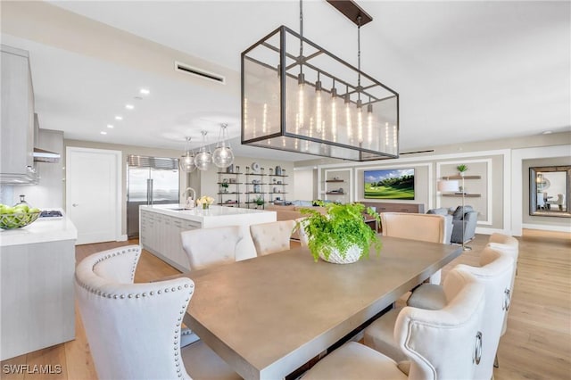 dining area featuring visible vents, recessed lighting, and light wood-type flooring