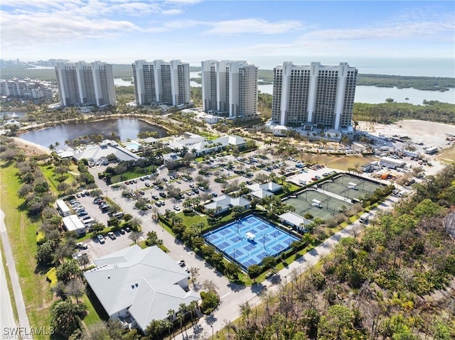 aerial view featuring a city view and a water view