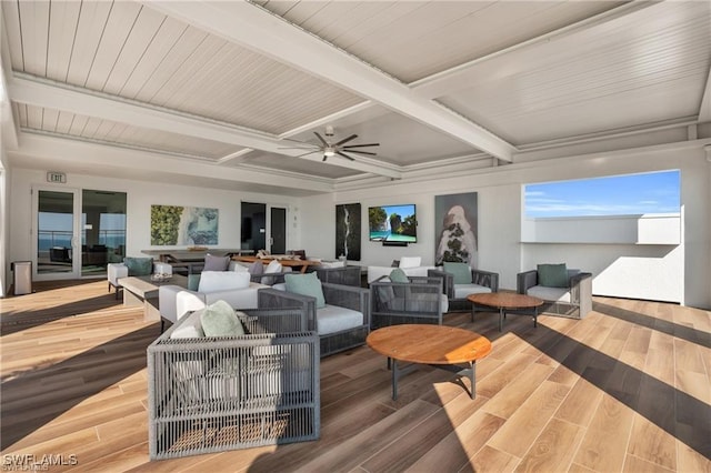 interior space with an outdoor living space and a ceiling fan