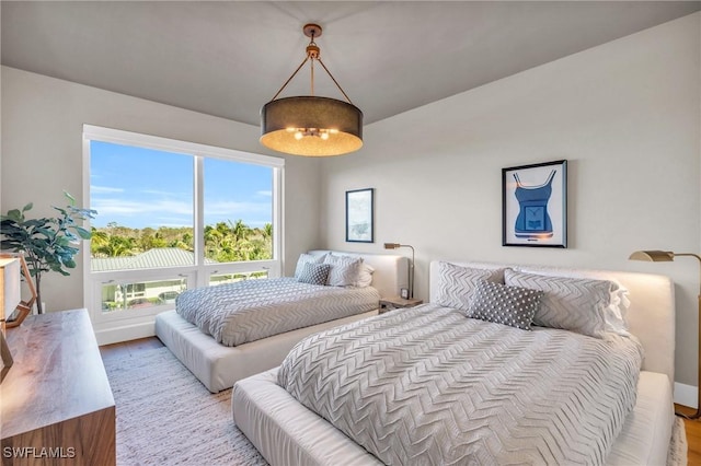 bedroom featuring wood finished floors