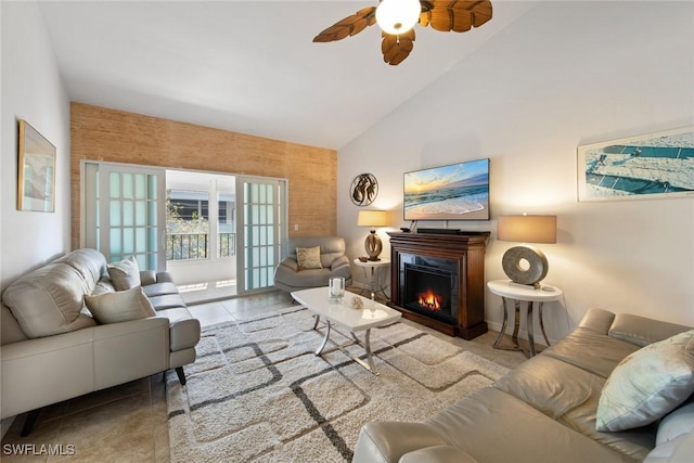 402 SE 42nd Ter Unit D-7, Cape Coral, FL 33904 - tiled living room with a warm lit fireplace, high vaulted ceiling, and a ceiling fan
