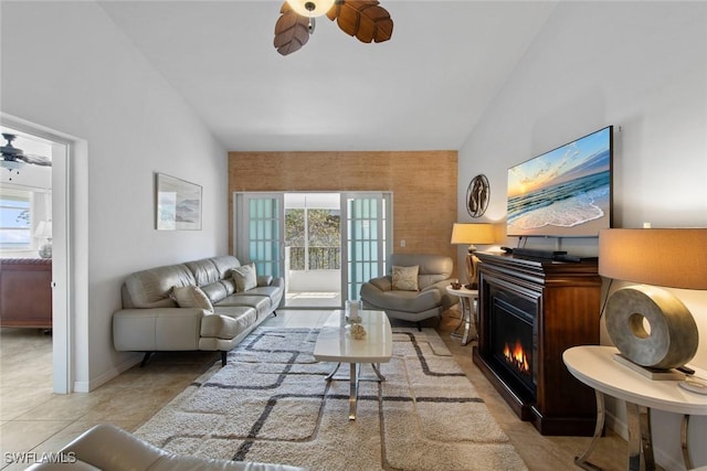 402 SE 42nd Ter Unit D-7, Cape Coral, FL 33904 - living room with a ceiling fan, a glass covered fireplace, lofted ceiling, and a wealth of natural light