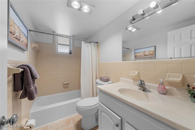 402 SE 42nd Ter Unit D-7, Cape Coral, FL 33904 - full bath featuring tile patterned flooring, tile walls, toilet, shower / bath combo with shower curtain, and wainscoting
